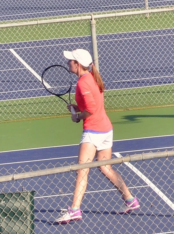 Woman Playing Doubles with a Wilson Tennis Racquet