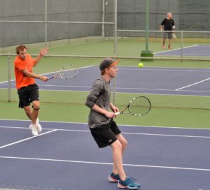 Mens doubles match in Austin tennis league