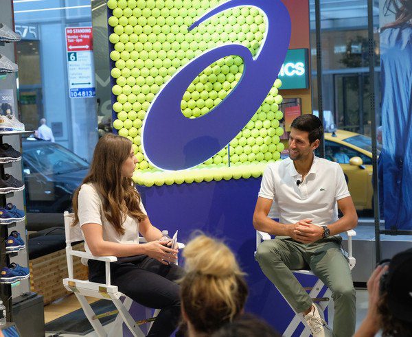 Jamie Lisanti chats with World No. 1 Novak Djokovic during an Asics event