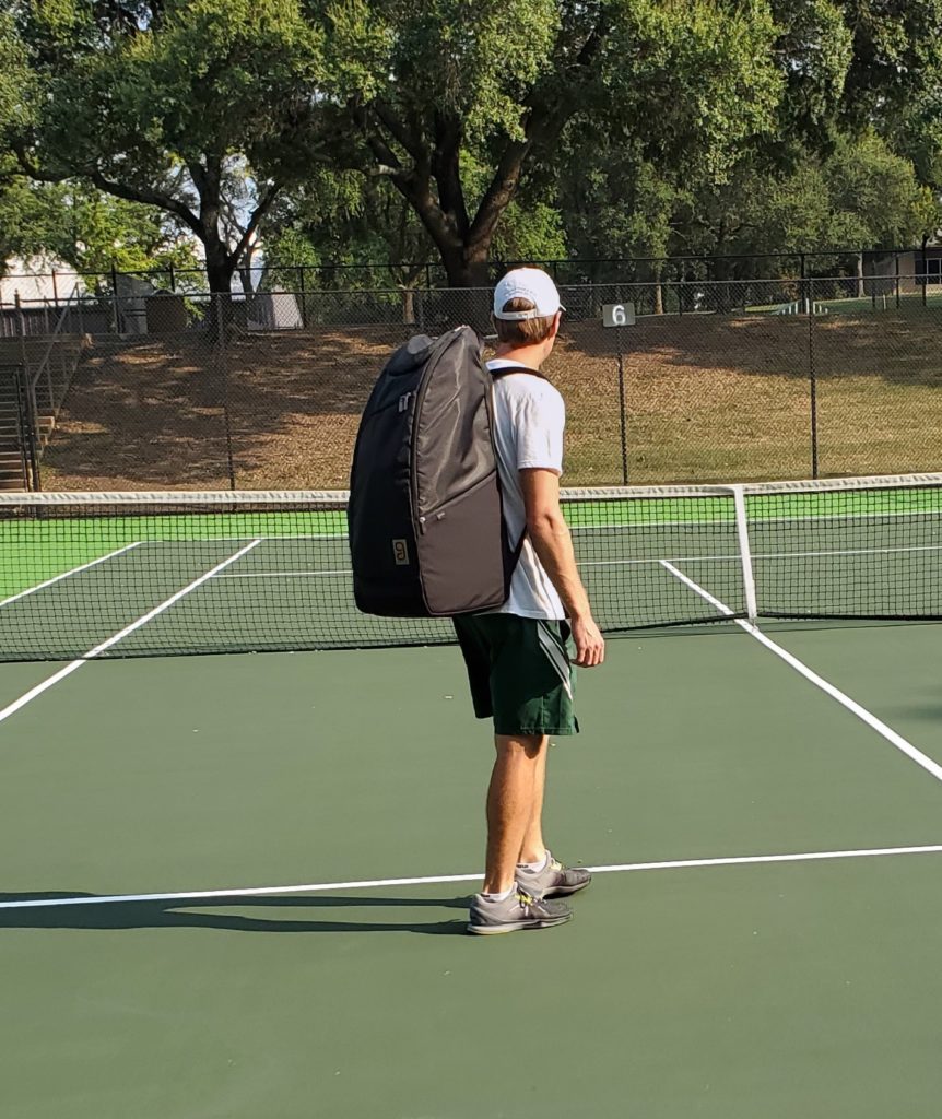 Wearing a tennis bag