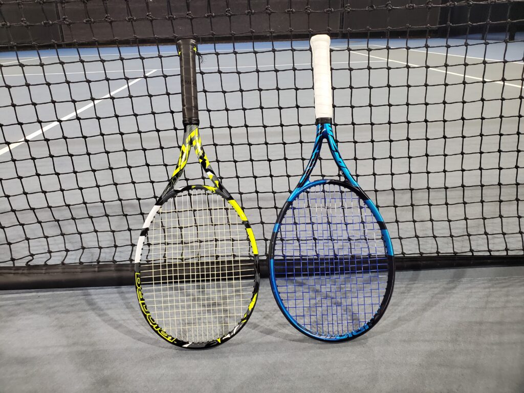 Babolat Pure Aero and Pure Drive tennis racquets on the tennis court