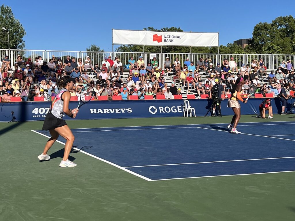 Jessica Pegula and Coco Gauff prepare to return a serve at the 2022 National Bank Open in Toronto
