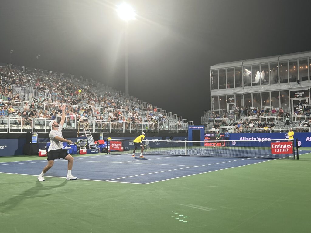 Jack Sock hits a serve in a doubles match at the 2022 Atlanta Open