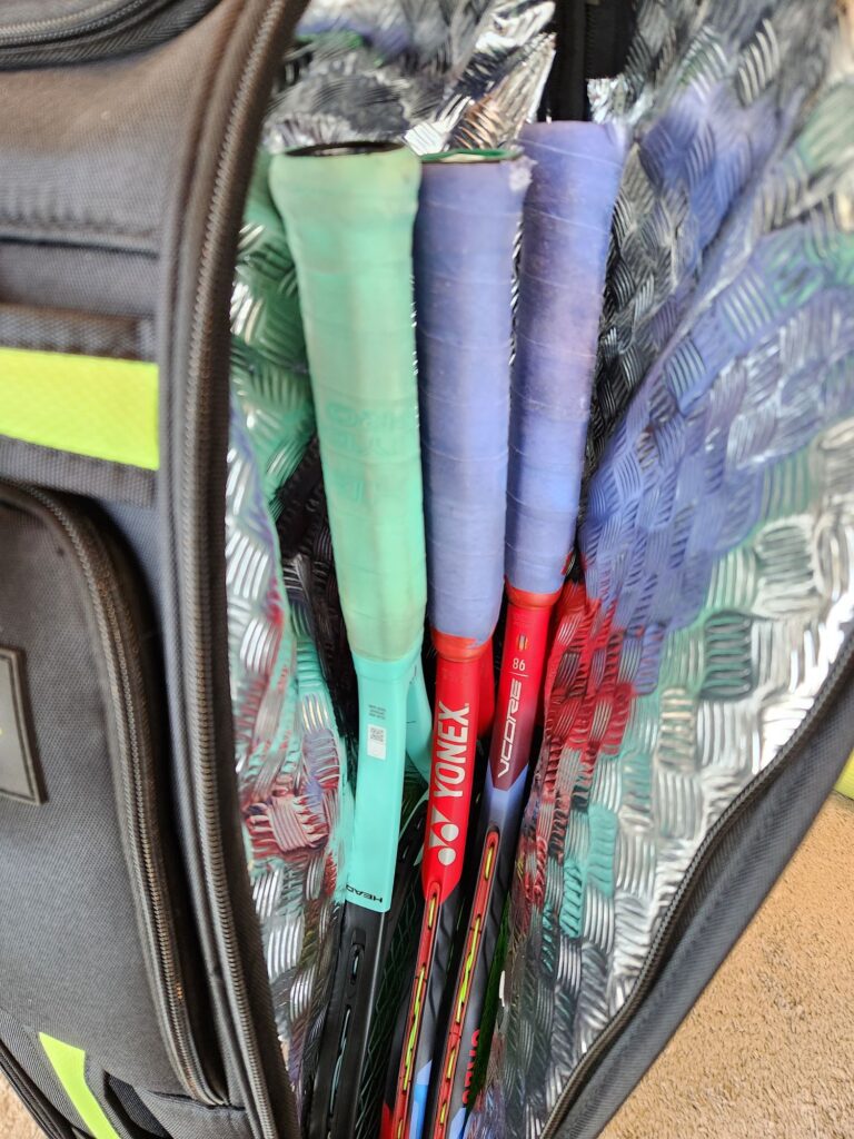 Rocket tennis bag racquet compartment