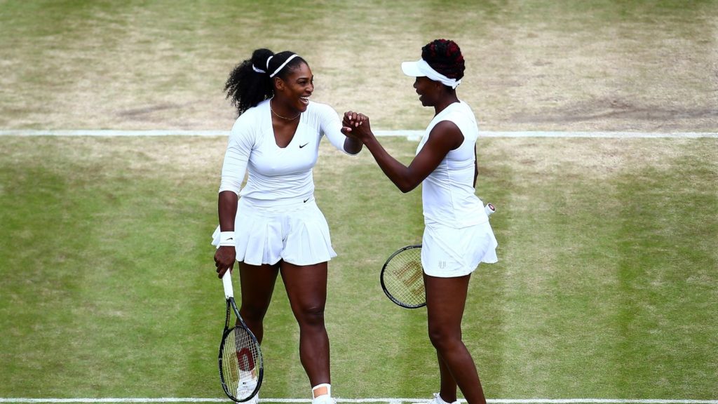 Serena and Venus playing doubles at Wimbledon