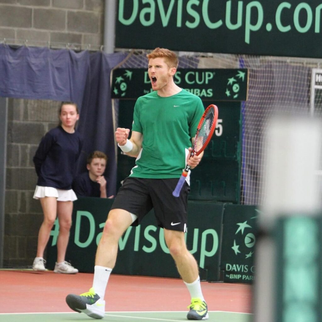Dave O'Hare, the coach of the top doubles team in the world, celebrating a point during his playing career.